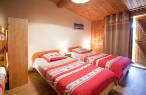Postel nebo postele na pokoji v ubytování La Roche du Croue