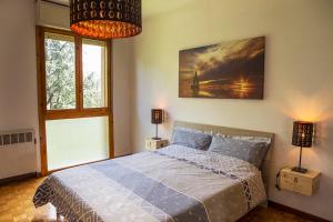 A bed or beds in a room at Residenze Bellaria Park "Riverside"
