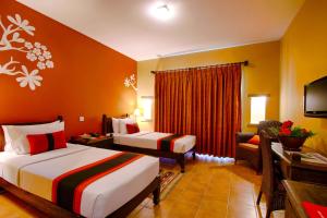 Ein Bett oder Betten in einem Zimmer der Unterkunft Temple Tree Resort & Spa