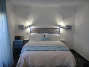 En eller flere senger på et rom på Casa Oasis