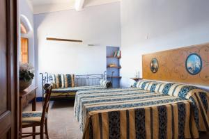 A bed or beds in a room at Poderi Arcangelo