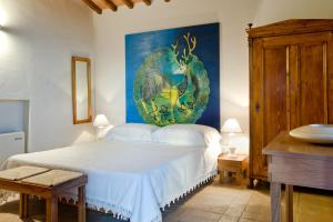 A bed or beds in a room at Poderi Arcangelo