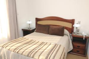 Postel nebo postele na pokoji v ubytování Hotel Ontiveros