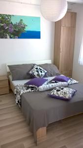 Posteľ alebo postele v izbe v ubytovaní Apartment Kamelia