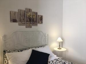 A bed or beds in a room at MiRhome Guest House