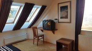Televisyen dan/atau pusat hiburan di Lipno Apartmany Frymburk I.