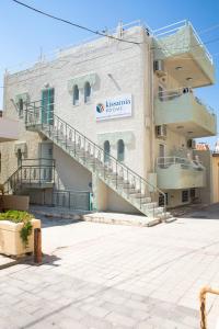 a building with stairs on the side of it at Kissamia Rooms - Next to Night Clubs in Kissamos
