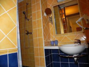 a bathroom with a sink and a mirror at Apartments Katalenić in Selce +73 photos