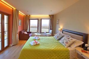 Posteľ alebo postele v izbe v ubytovaní Arktos Hotel