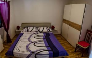Postel nebo postele na pokoji v ubytování Apartments & Room Toni