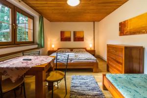 Postel nebo postele na pokoji v ubytování Apartmány a štúdiá Miroslav
