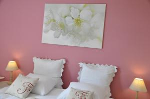 Postel nebo postele na pokoji v ubytování B&B Le Verger du Pierroy