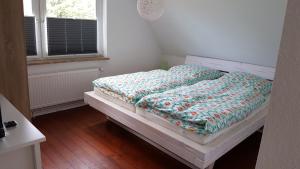 Ein Bett oder Betten in einem Zimmer der Unterkunft Ferienhaus Martha