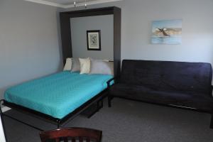 Ένα ή περισσότερα κρεβάτια σε δωμάτιο στο North 99 Motel