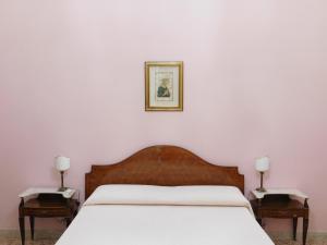 Ένα ή περισσότερα κρεβάτια σε δωμάτιο στο Appartamento Belvedere
