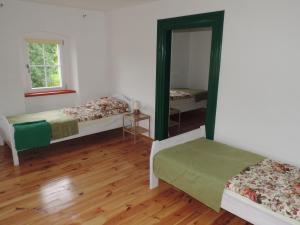 Postel nebo postele na pokoji v ubytování Pod Miotełką