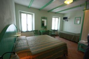 Letto o letti in una camera di Albergo Belvedere