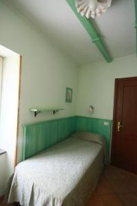 Letto o letti in una camera di Albergo Belvedere