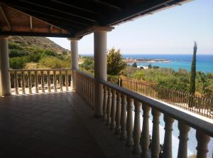 a balcony with a view of the ocean at Pomos Harbourbiew Villa in Pomos