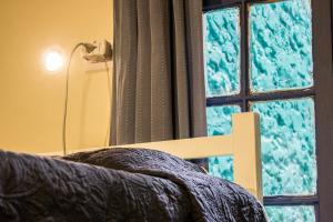 Postel nebo postele na pokoji v ubytování Hostal Forestal