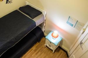Postel nebo postele na pokoji v ubytování Hostal Forestal