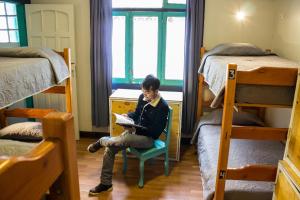 Postel nebo postele na pokoji v ubytování Hostal Forestal