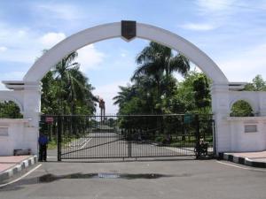 an archway with an open gate in a park at Grand Pasundan Convention Hotel in Bandung