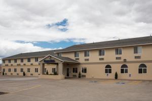 a hotel with a parking lot in front of it at Days Inn by Wyndham Hurricane/Zion National Park Area in Hurricane
