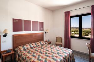 Postel nebo postele na pokoji v ubytování Hotel Brigantino Non Dista