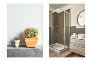 a bathroom with a shower and a sink with a potted plant at Casa Anne Marie in La Spezia +13 photos