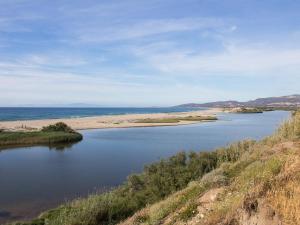 a view of a body of water with a beach at Casa Vacanza Valledoria in Valledoria +3 photos