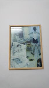 een schilderij van een persoon die in een kamer staat bij Stella Maris Hosting in Haifa