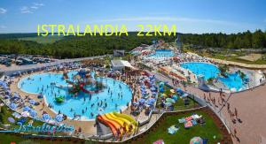 an aerial view of a water park with two pools at Yellow Submarine in Portorož
