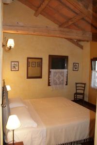 Postel nebo postele na pokoji v ubytování Locanda Antico Fighèr