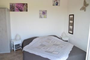 a bedroom with a bed with a blanket on it at La Provence in Vaison-la-Romaine +12 photos