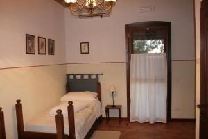 Postel nebo postele na pokoji v ubytování Locanda Antico Fighèr