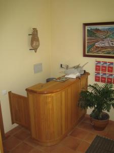 a desk in a room with a phone on the wall at Casa Martín in Poza de la Sal