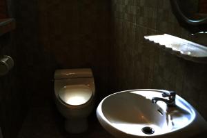 a bathroom with a sink and a toilet at BRICKHOUSE Ayutthaya Guesthouse EST 1986 in Phra Nakhon Si Ayutthaya +31 photos