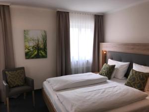 Postel nebo postele na pokoji v ubytování Hotel Kronprinz + 22 fotografií