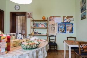 a room with a table with a bowl of food on it at B&B San Russorio in Pisa