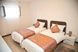 Postel nebo postele na pokoji v ubytování Deluxe Apartment Nika