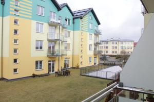 a view from the balcony of a building with a tennis court at Apartament Tiffany in Gdańsk