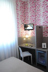 TV a/nebo společenská místnost v ubytování Hotel Astoria