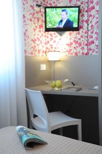 TV a/nebo společenská místnost v ubytování Hotel Astoria