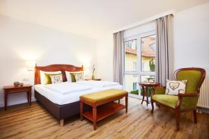 Ein Bett oder Betten in einem Zimmer der Unterkunft Hotel Prinzregent München