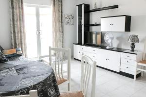 a bedroom with a bed and a dresser at Stunning La Mata Beach Suite in La Mata