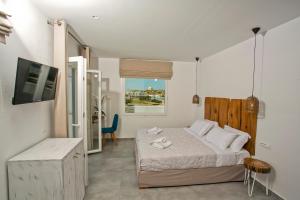 Posteľ alebo postele v izbe v ubytovaní Anna-Maria Mykonos Hotel + 37 fotografií