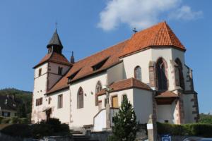 a large white church with a red roof at Chambres d'Hôtes Arnold in Dambach-la-Ville