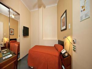 Ένα ή περισσότερα κρεβάτια σε δωμάτιο στο Austral Express