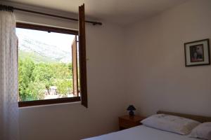 Postel nebo postele na pokoji v ubytování Orebic Garden House